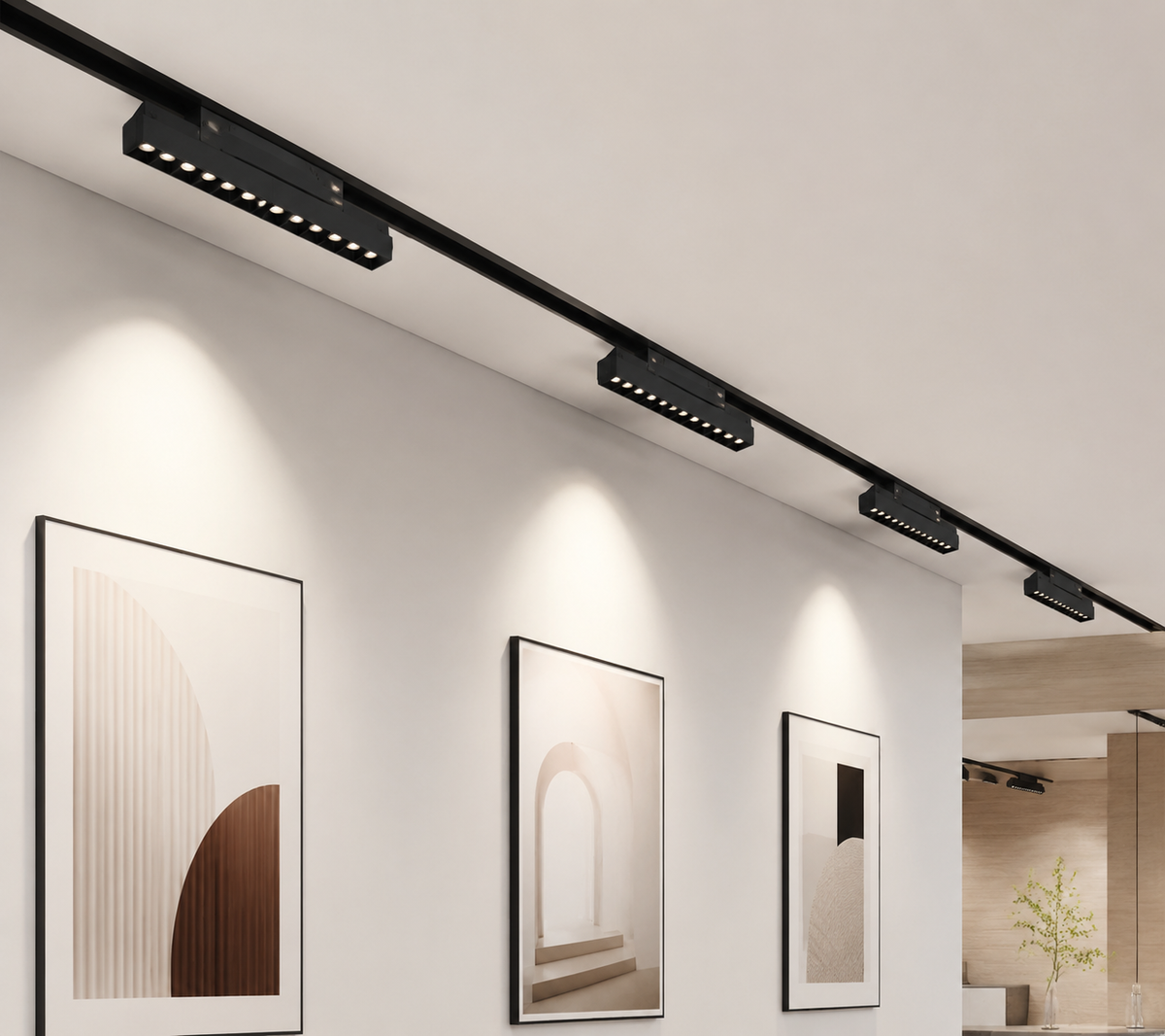 MEN Series gallery installation - black magnetic track with ultra-slim linear modules showing warm white beam on artwork and architectural space